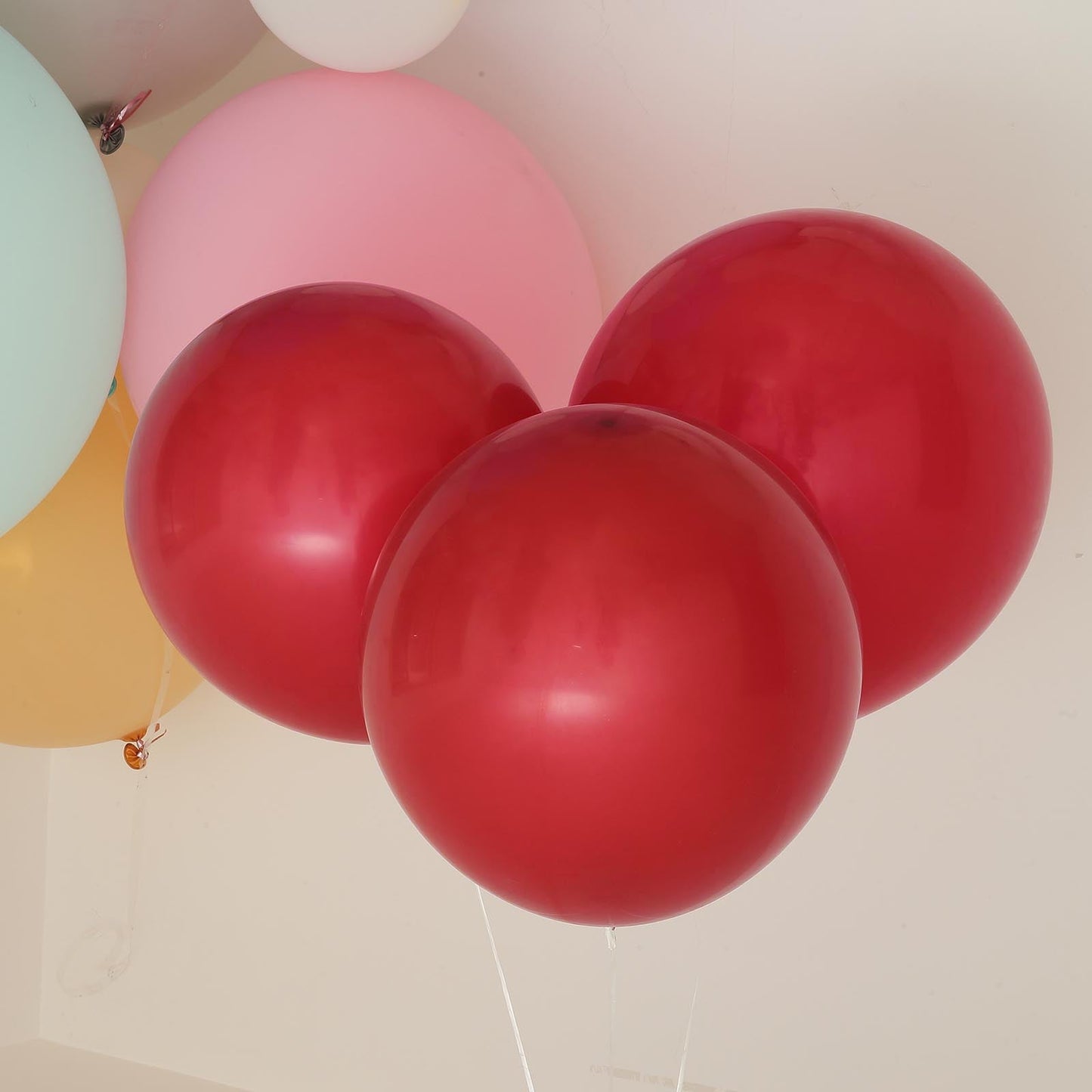 Matte pastel burgundy latex party balloons, perfect for celebrations.