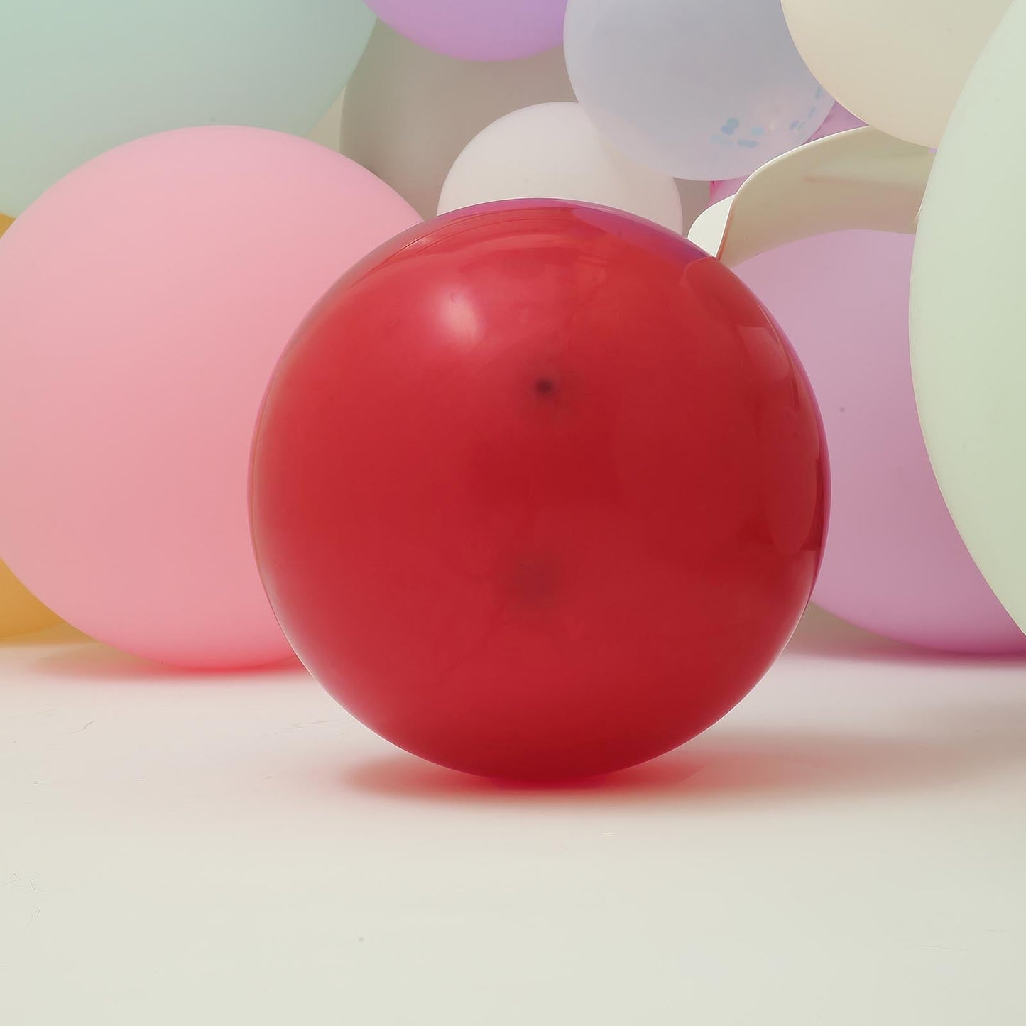 Matte pastel burgundy helium or air latex party balloon.