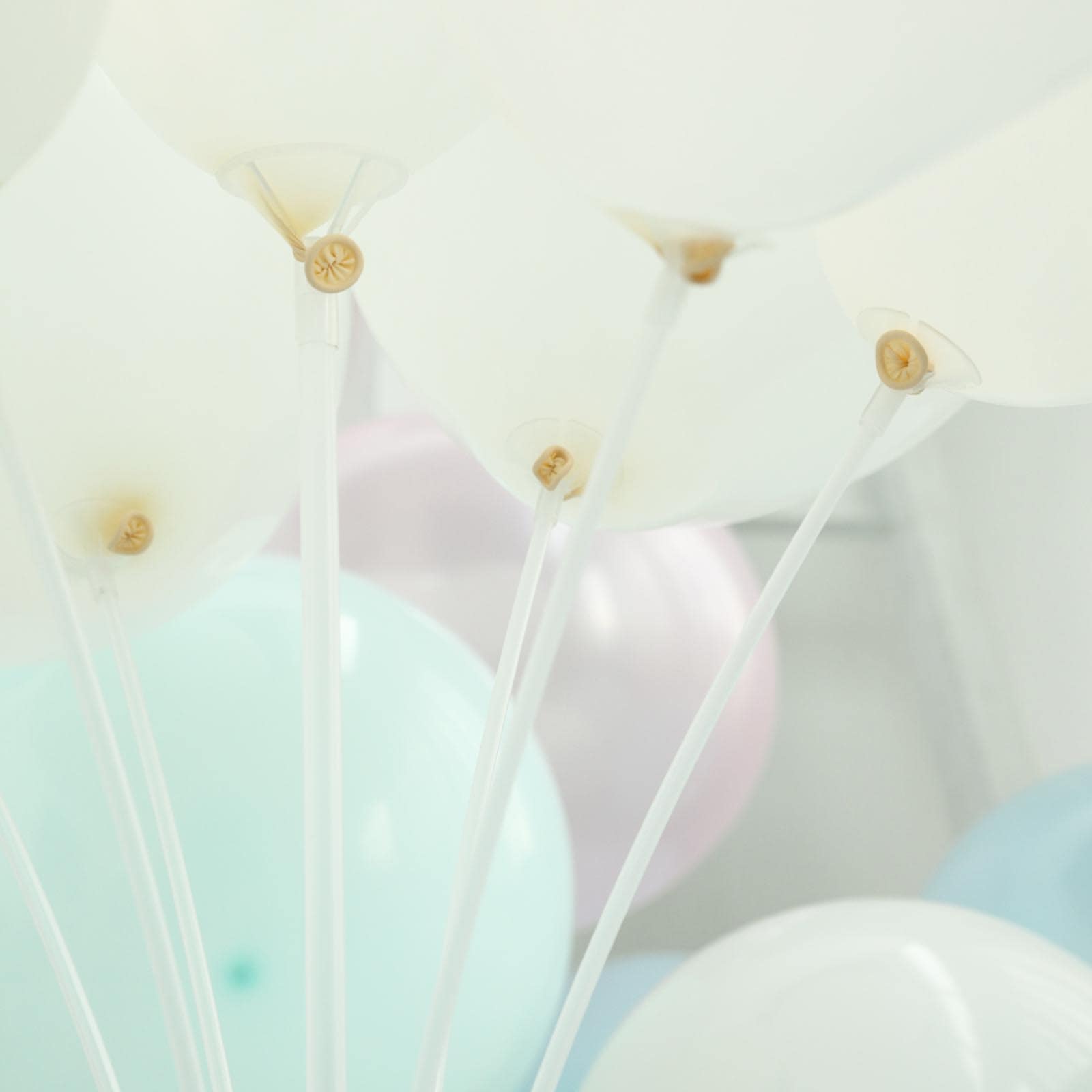Clear balloon centerpiece holder kit with white balloons.