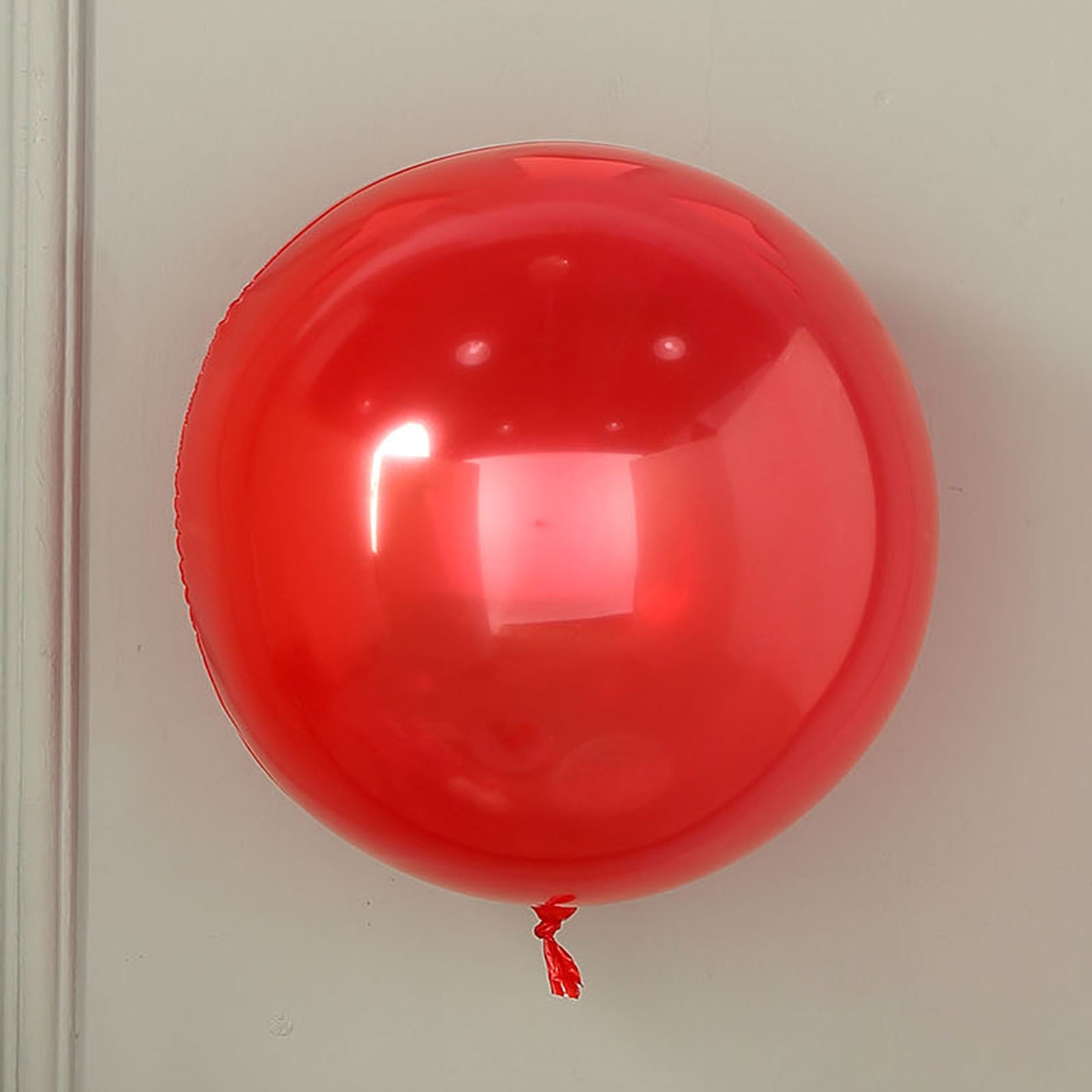Shiny red reusable UV protected vinyl balloon.