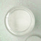 Nontoxic white extra fine glitter in a 1 lb bottle for arts and crafts.