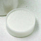 Nontoxic white extra fine glitter in a round container.