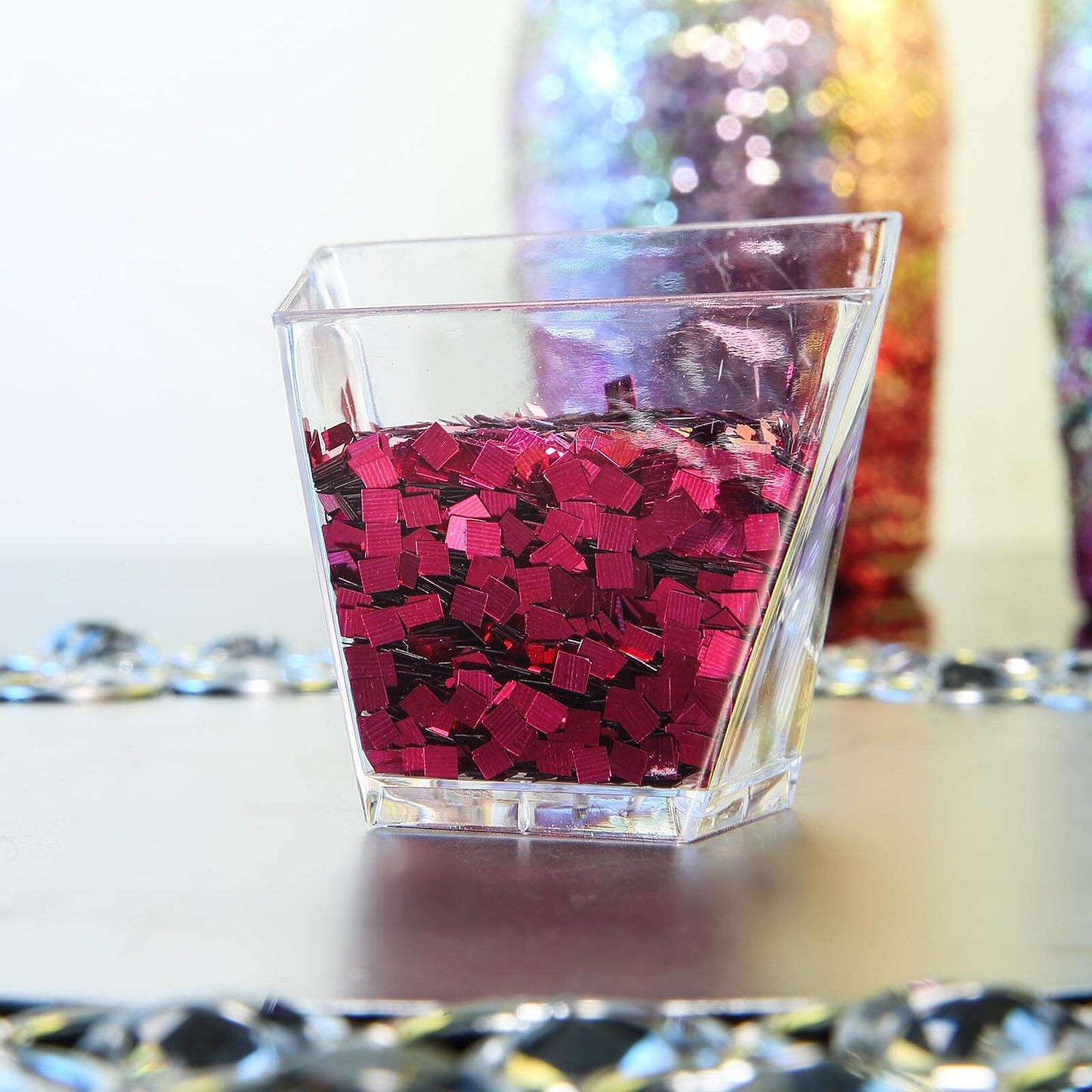 Metallic hot pink chunky confetti glitter in a clear container.