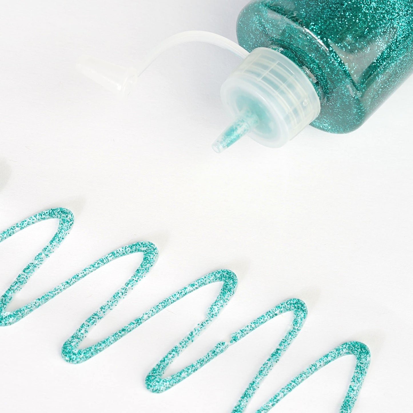 Metallic turquoise glitter glue for arts and crafts projects.