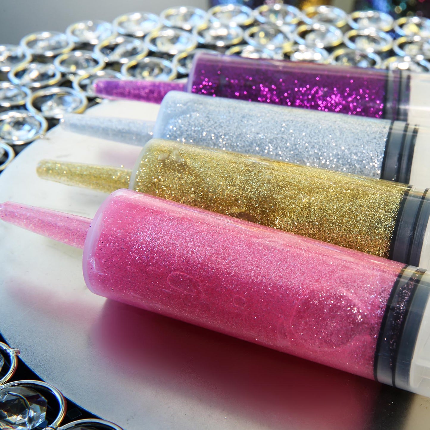 Metallic turquoise glitter glue for DIY crafts and sensory bottles.