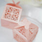 Blush butterfly top laser cut favor candy gift boxes in a pink color.