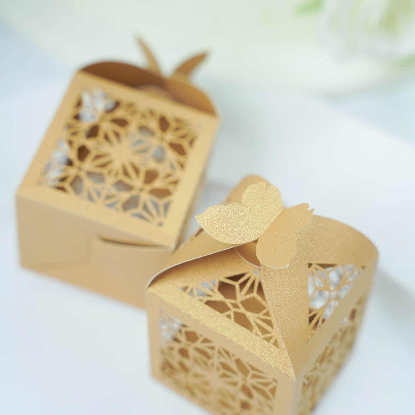 Gold butterfly top laser cut lace favor candy gift boxes.