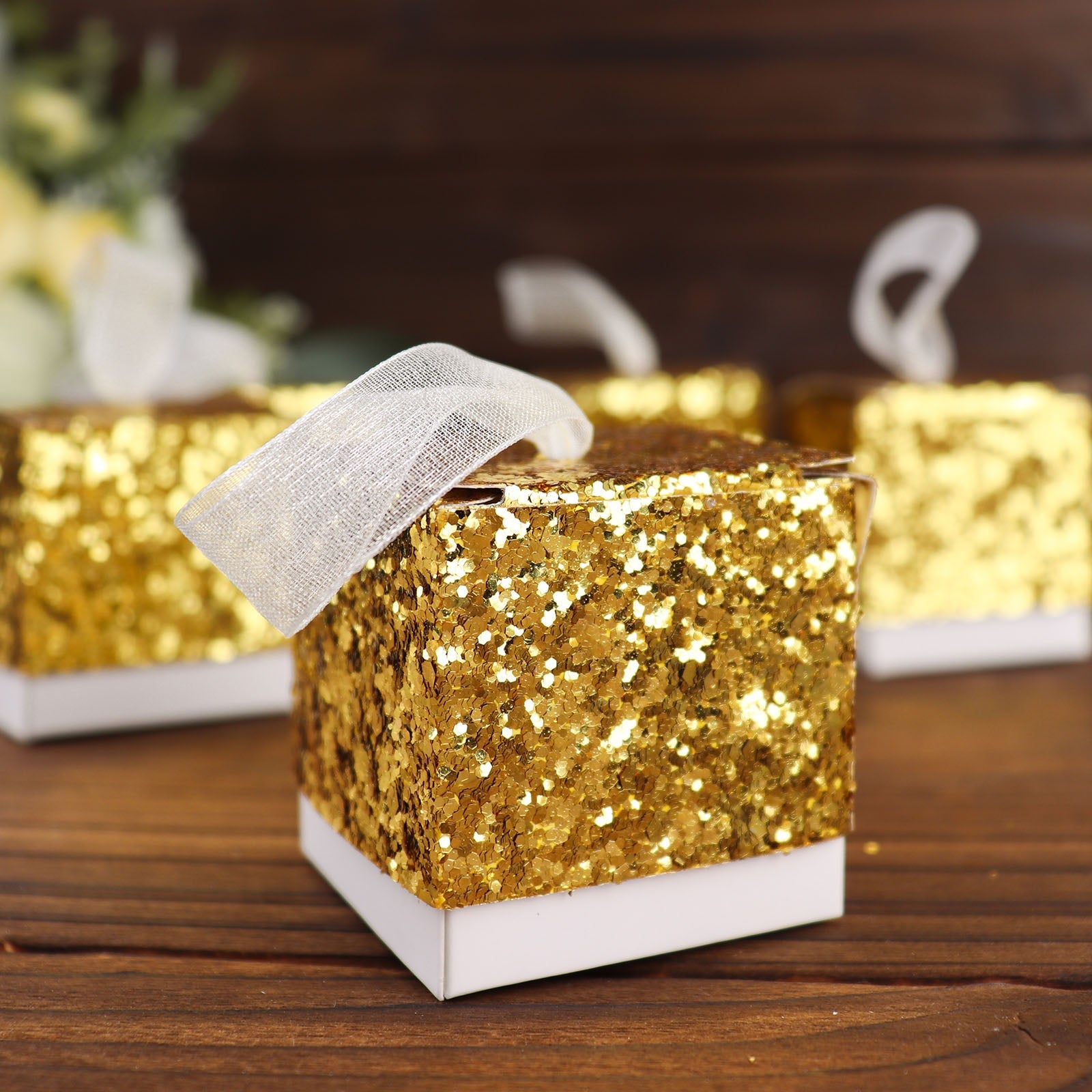 Gold sequin glitter mini gift box with white ribbon, perfect for party favors.