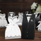 White wedding dress and tuxedo candy gift boxes with ribbon ties.