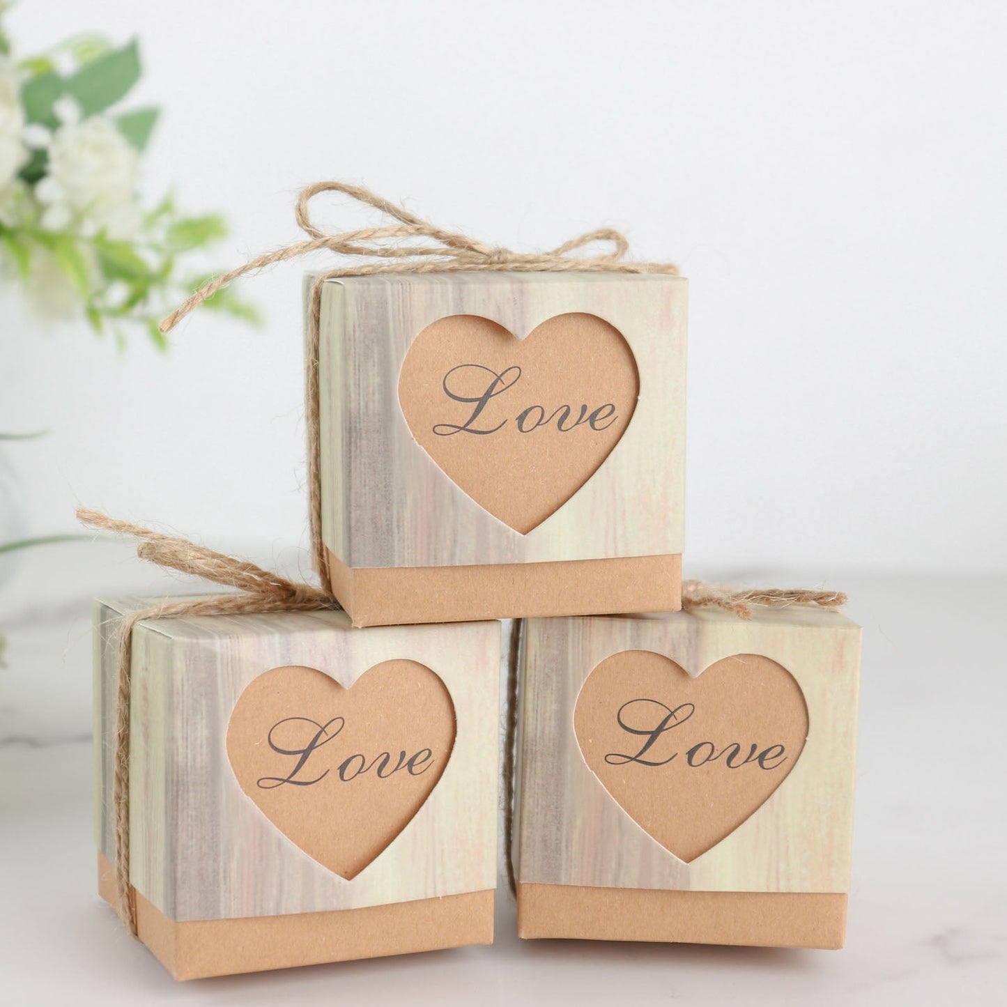 Natural brown rustic wood pattern gift boxes with love heart cutouts.