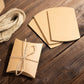 Natural brown paper wedding favor pillow boxes with burlap twine.
