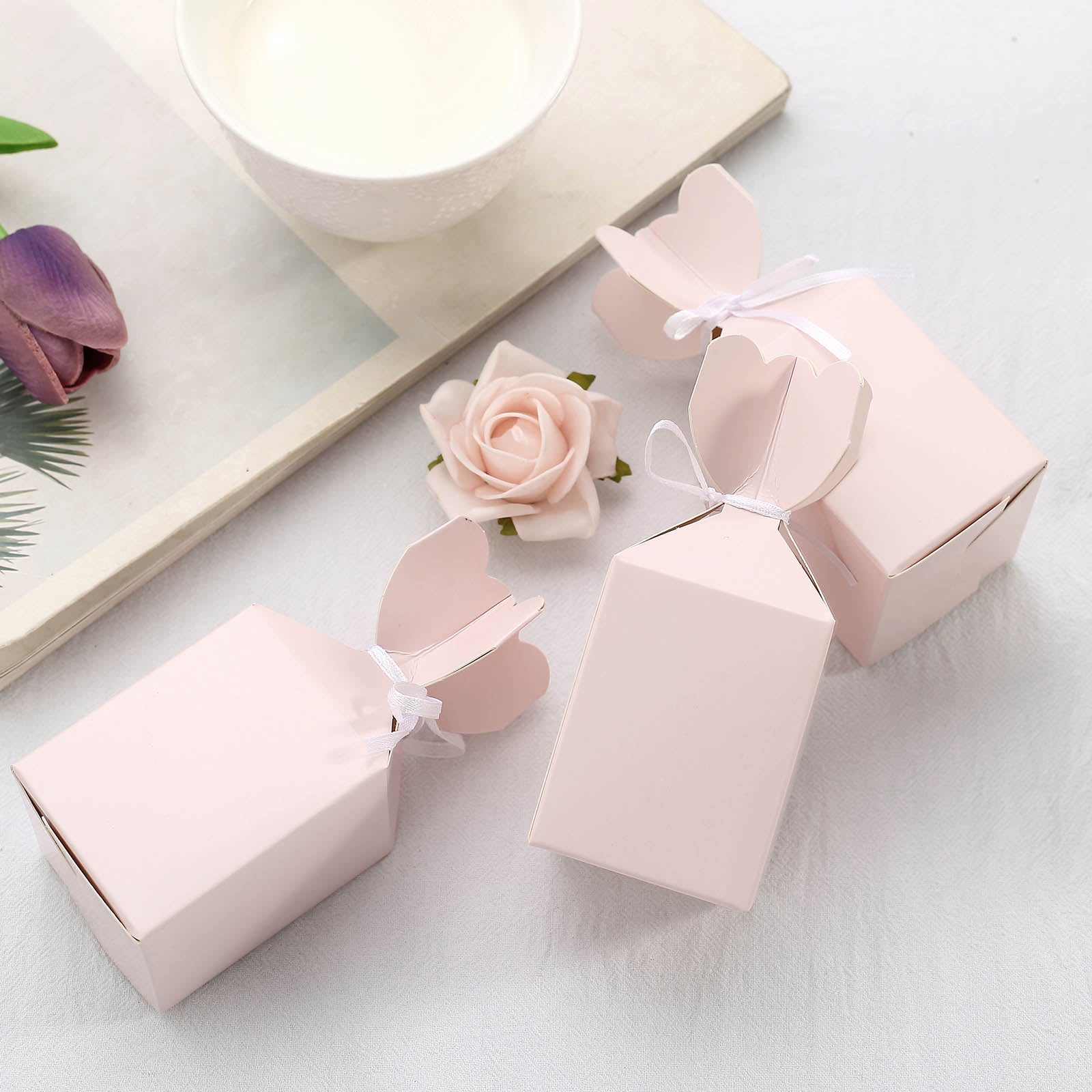 Blush floral satin ribbon gift boxes for party favors and candy.