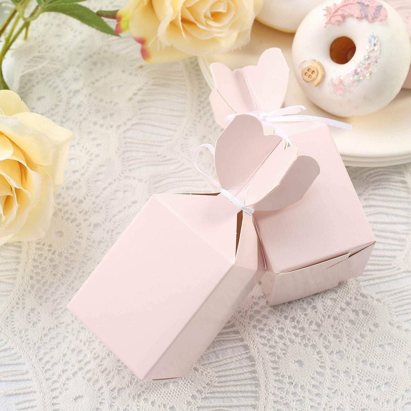 Blush floral satin ribbon candy gift boxes for party favors.