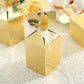 Gold floral satin ribbon gift boxes for party favors.