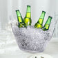Clear plastic ice bucket with drinks, ideal for parties and outdoor events.