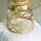 Matte gold metal princess crown cake topper for wedding decor.