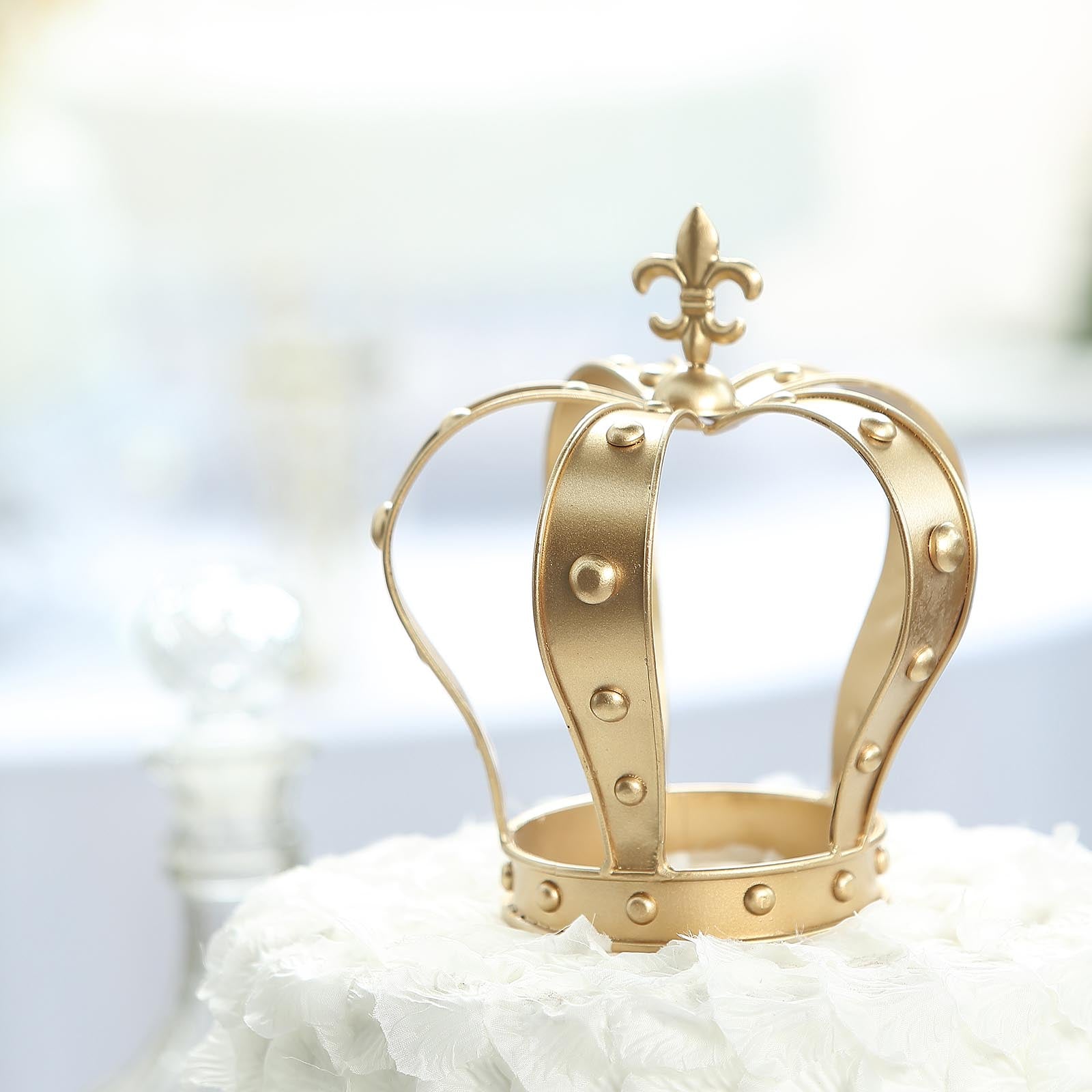 Gold metal fleur-de-lis crown cake topper centerpiece.