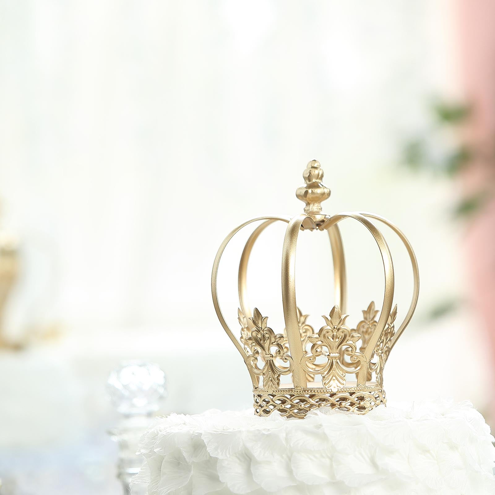 Gold metal fleur-de-lis royal crown cake topper centerpiece.