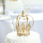Gold metal fleur-de-lis crown cake topper for royal celebrations.