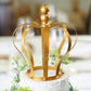 Matte gold metal royal crown cake topper for wedding decor.