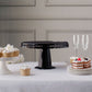 Black round pedestal cupcake stand with interchangeable ribbon trim edge.