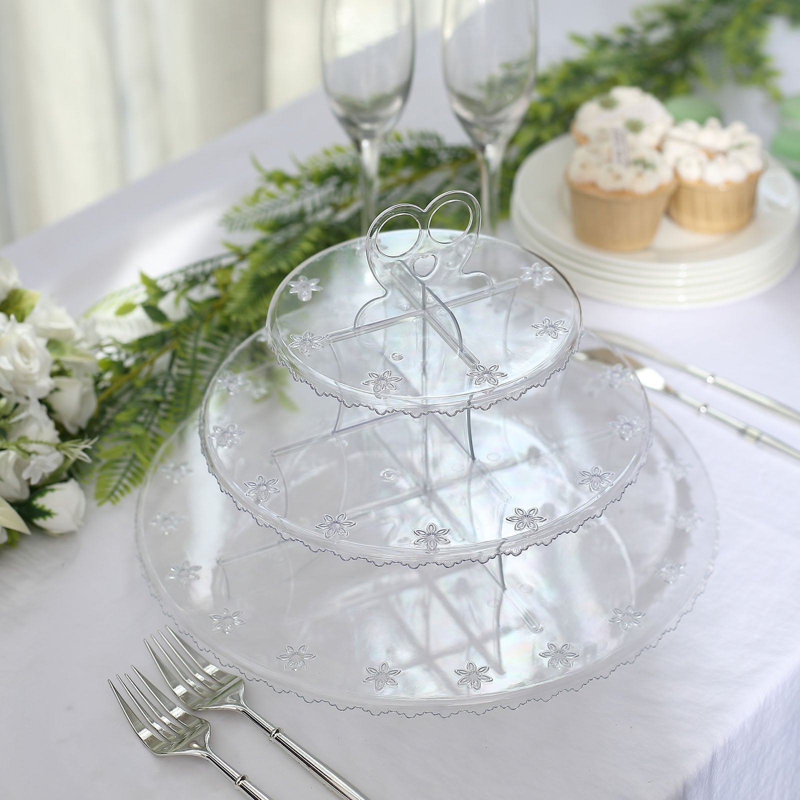 Clear 3-tier round plastic cake pop holder with floral cut rims.