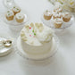 Clear contemporary pressed plastic cupcake stands displaying desserts.
