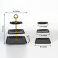 Black and gold 3-tier cupcake stand with heart wavy edges and top handle.
