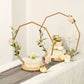 Gold floral hoop cake stand with wooden base, perfect for dessert display.