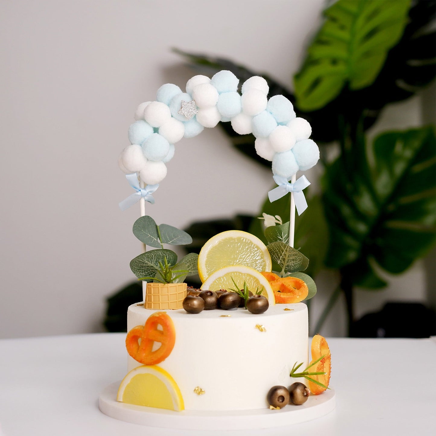 Blue and white mini arch cotton ball cake topper decoration.
