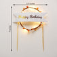 LED light up birthday cake topper with a golden "Happy Birthday" banner.