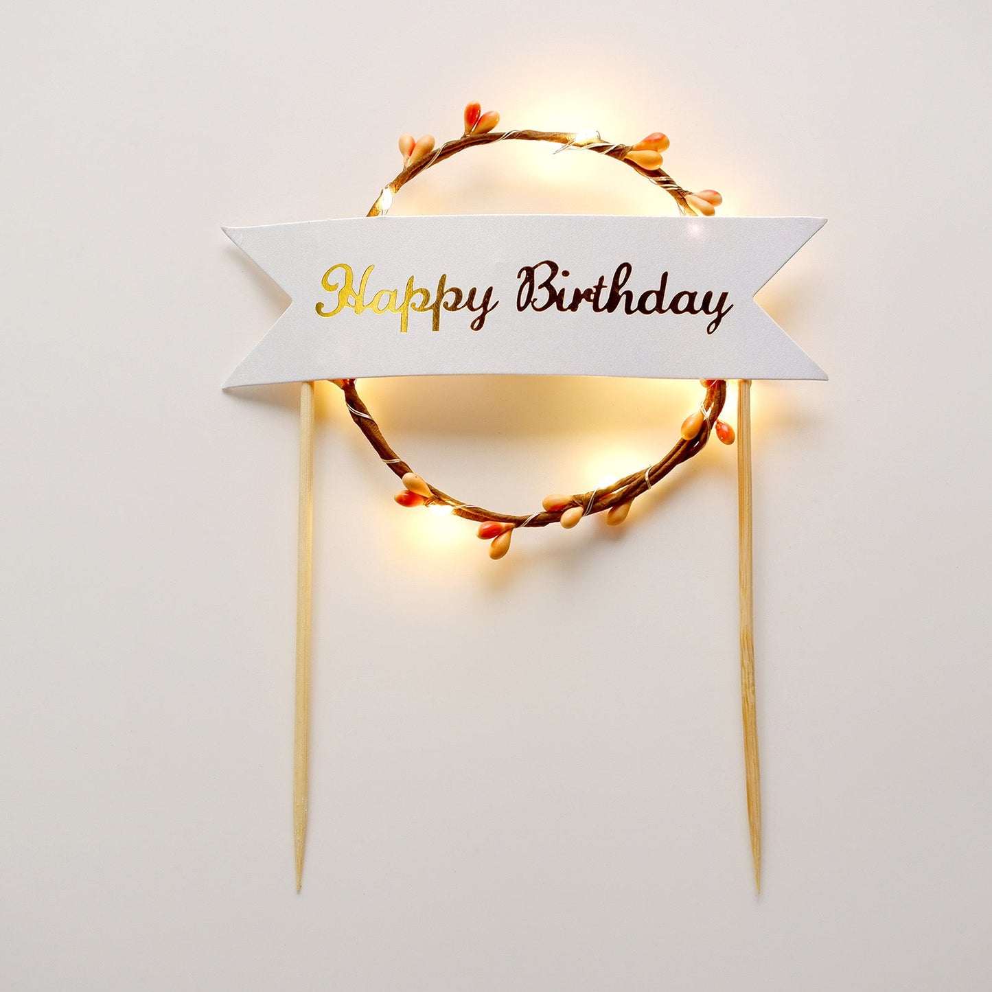 LED light up birthday cake topper with a glowing wreath design.