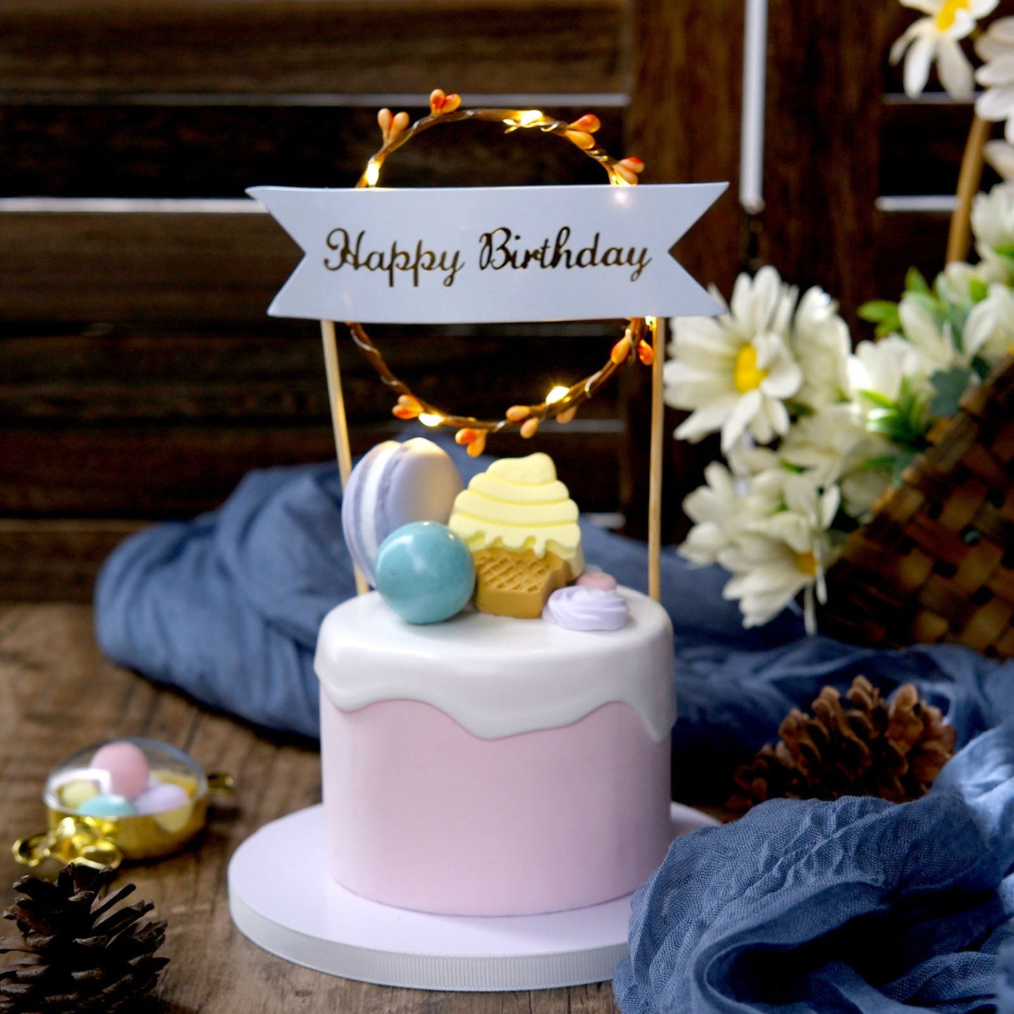 LED light up wreath birthday cake topper with pink and gold accents.
