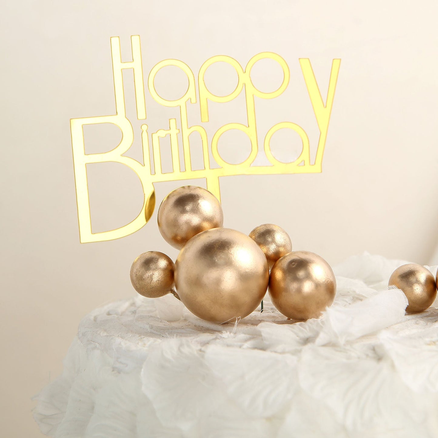 Gold faux pearl balls cake topper picks for birthday decorations.