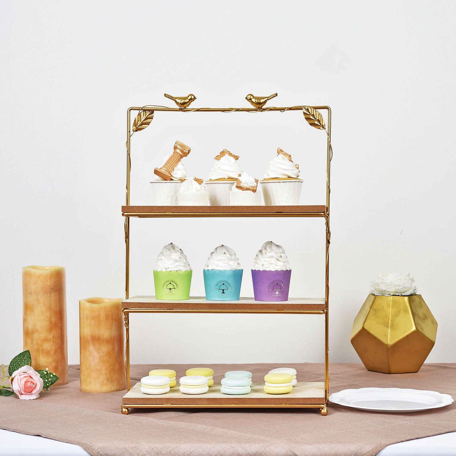 Gold 3-tier cheese board and cupcake stand with rustic wood slices.