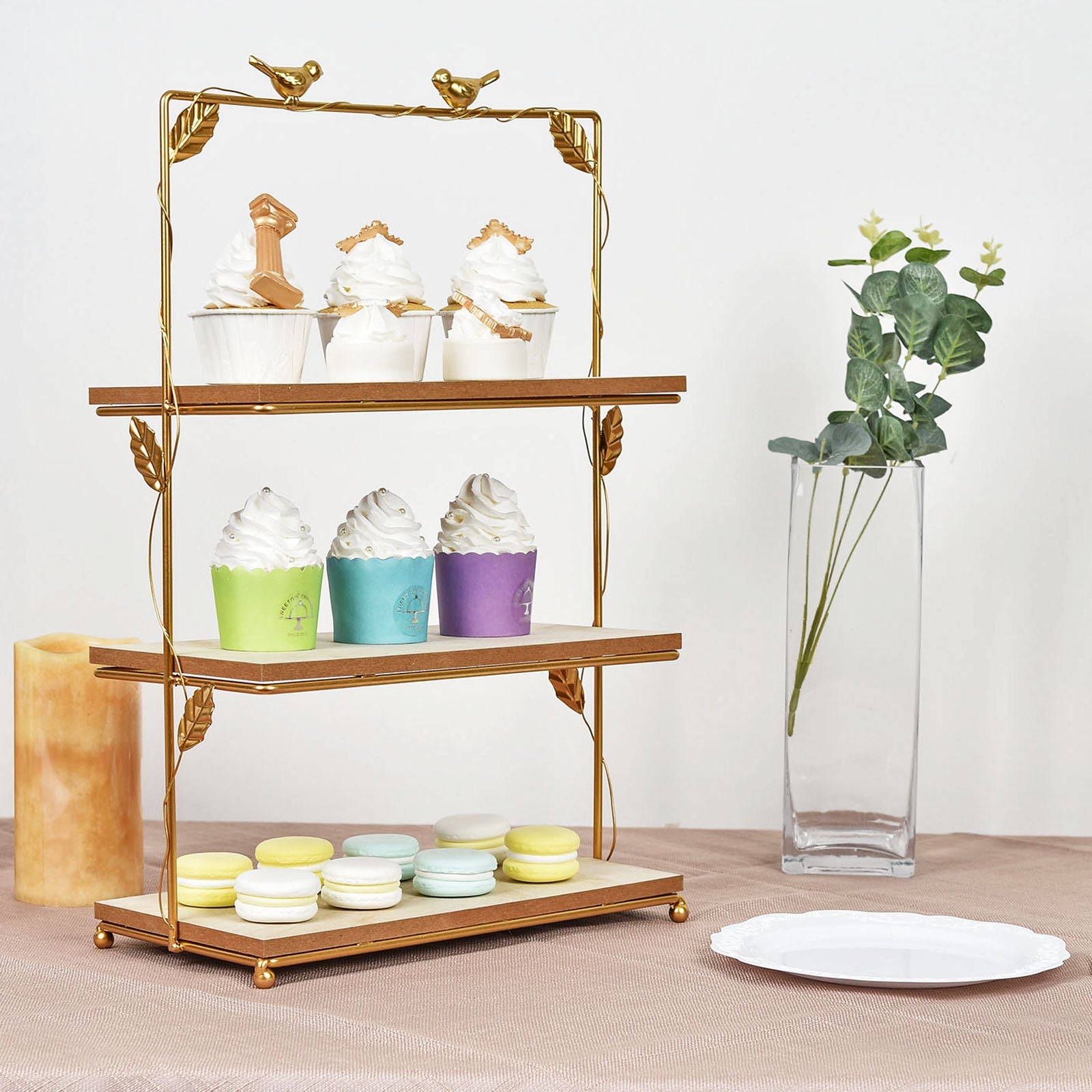 Gold 3-tier cheese board and cupcake stand with rustic wood slices.