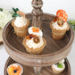 Rustic brown 2-tier wooden serving tray stand with cupcakes.