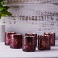 Burgundy mercury glass palm leaf candle holders, set of six.