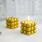 Metallic gold bubble cube decorative candles, unscented and long-burning.