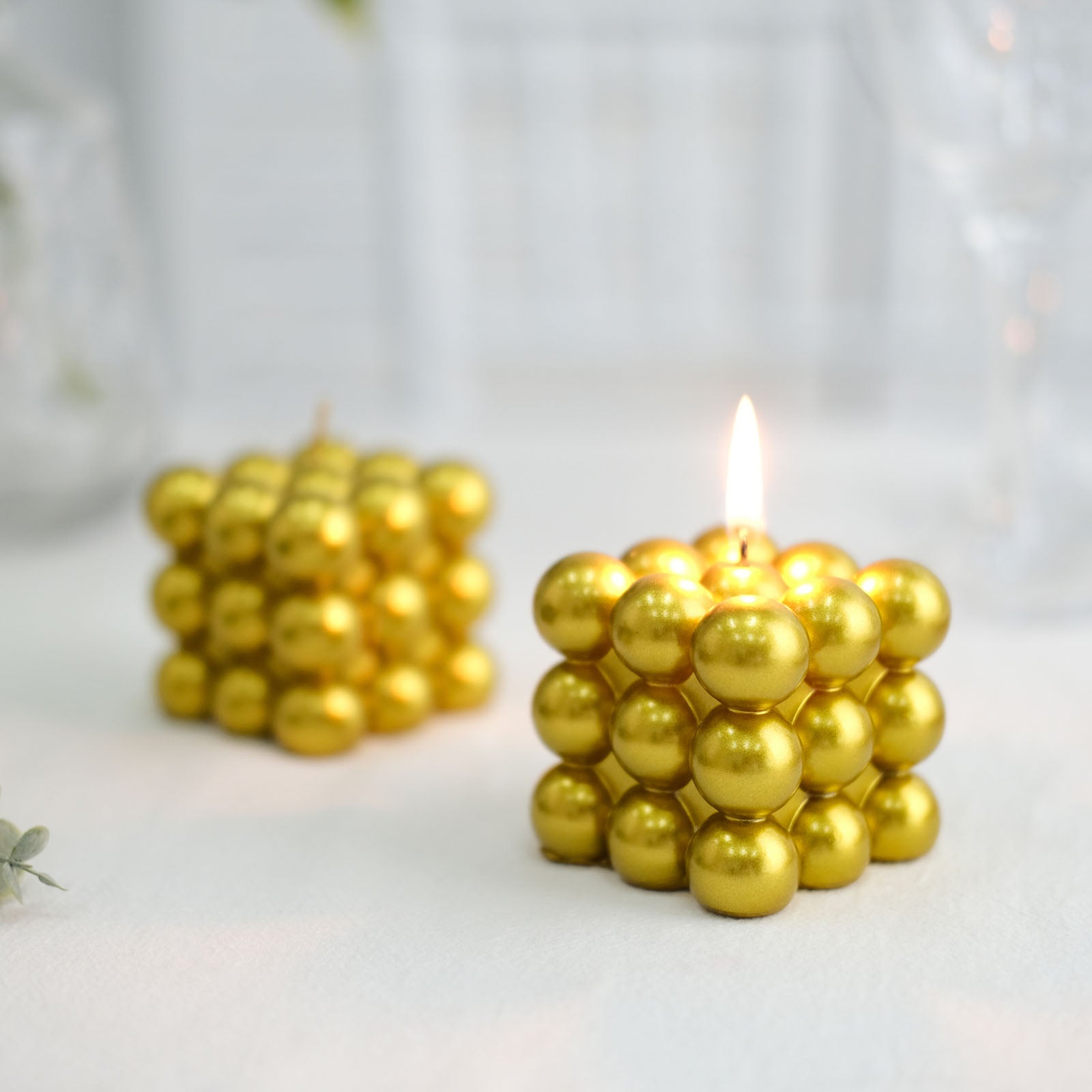 Metallic gold bubble cube decorative candles, unscented and long-burning.