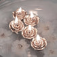 Rose gold mini rose floating candles for wedding vase fillers.