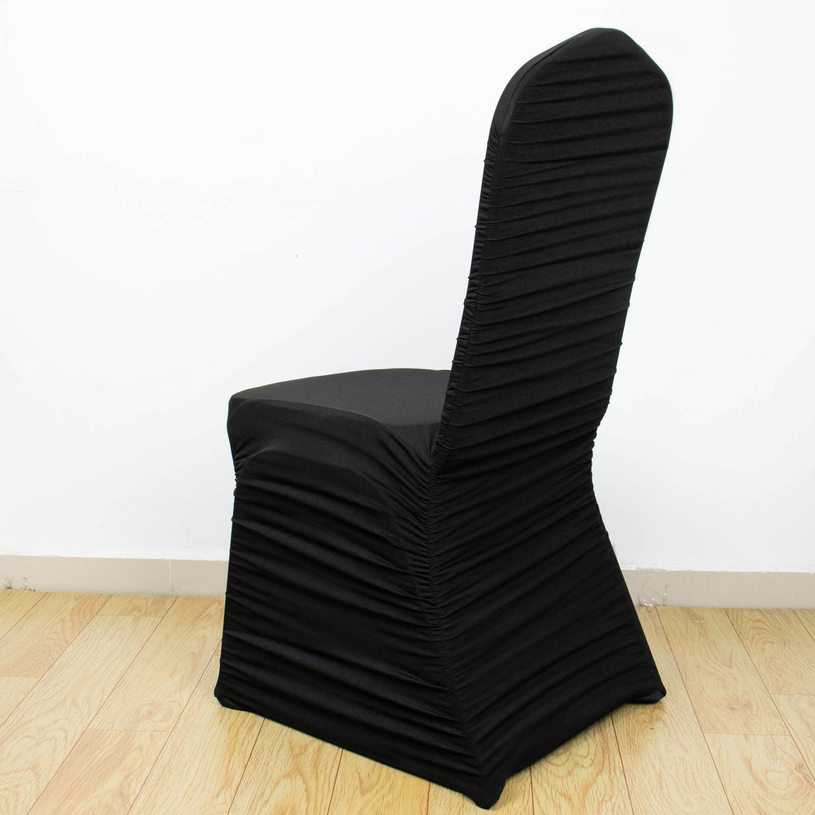 Black fitted banquet chair cover in stretch spandex.