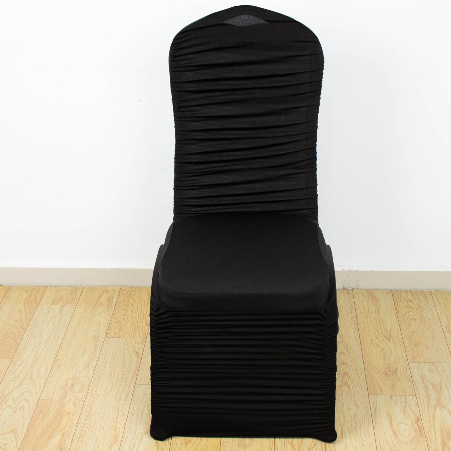 Black fitted banquet chair cover in stretch spandex.