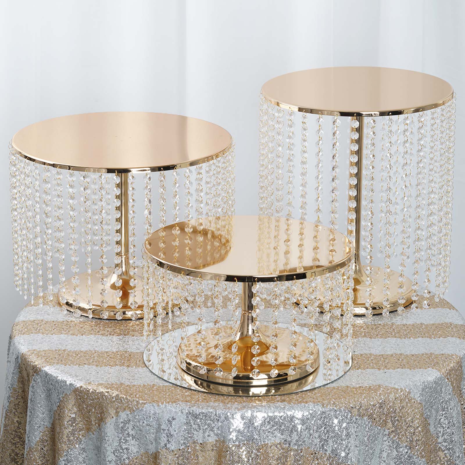 Metallic gold cake stand with crystal chains, 12" tall and 14" round.