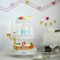 White 3-tier cupcake stand with colorful desserts displayed.