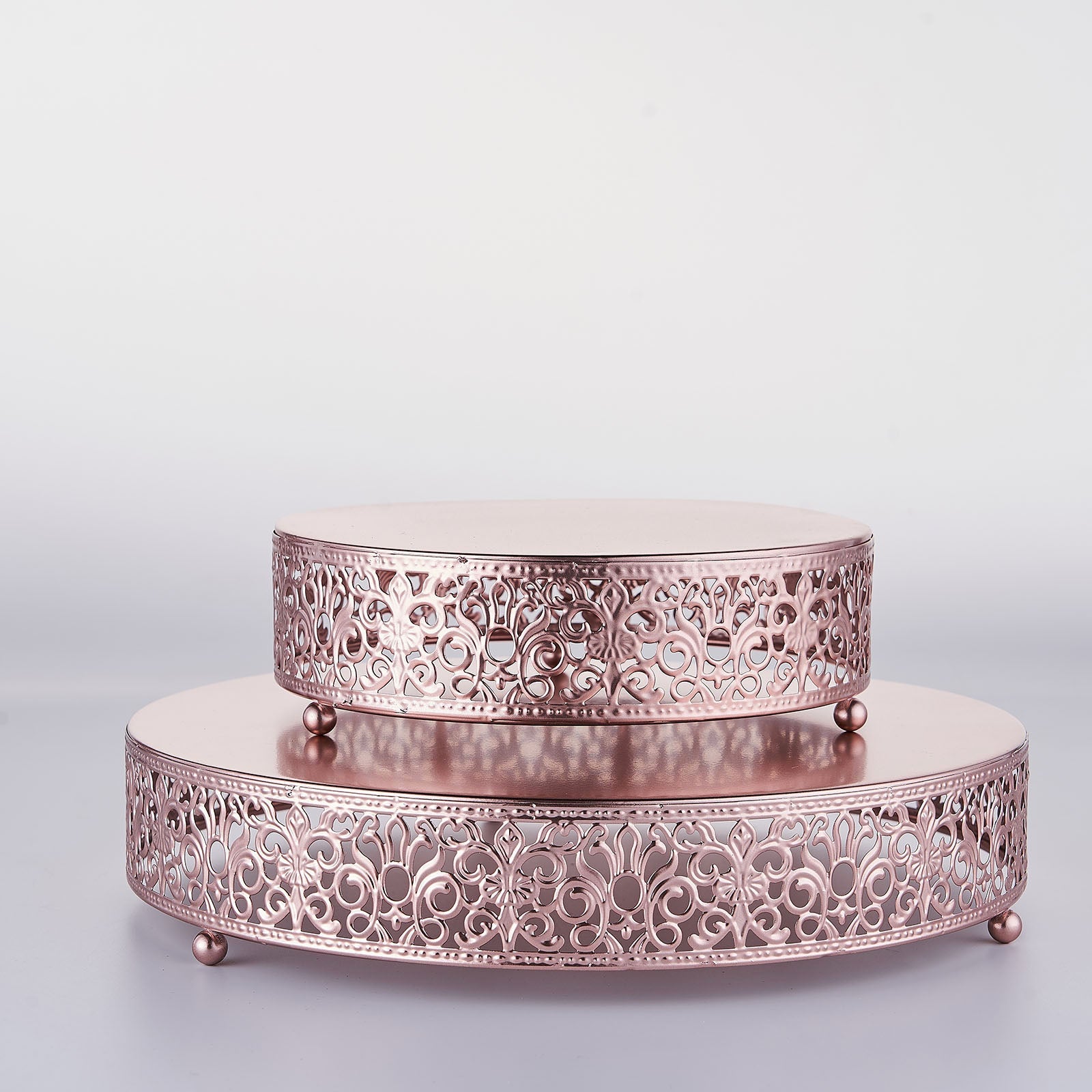 Rose gold Fleur De Lis wedding cake stand, round dessert display riser.