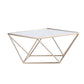 Gold geometric cake stand with square glass top, perfect for displays. #whtbkgd