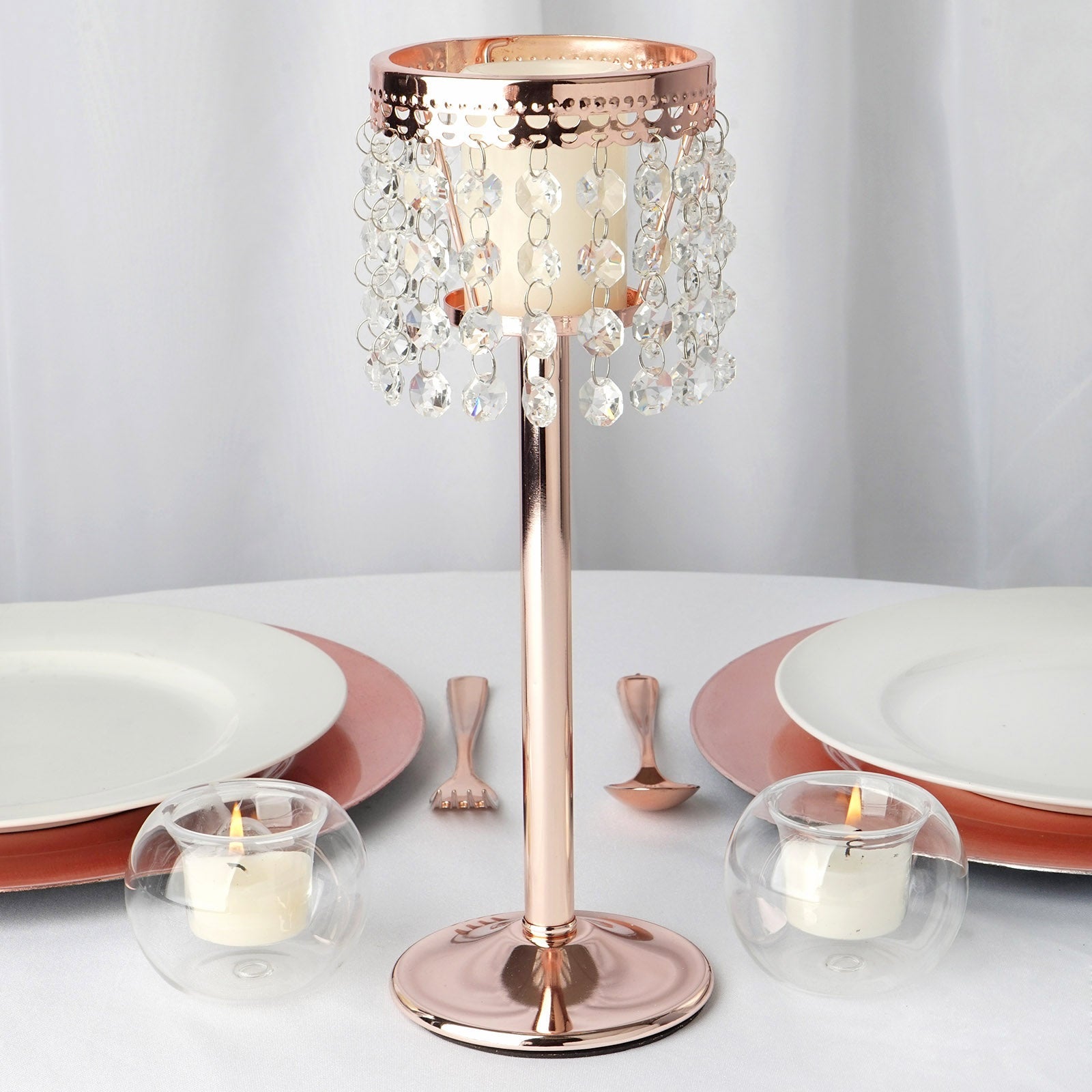 Rose gold crystal beaded chandelier candle holder on a table setting.