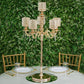 Gold pearl beaded candelabra centerpiece with crystal pendants.