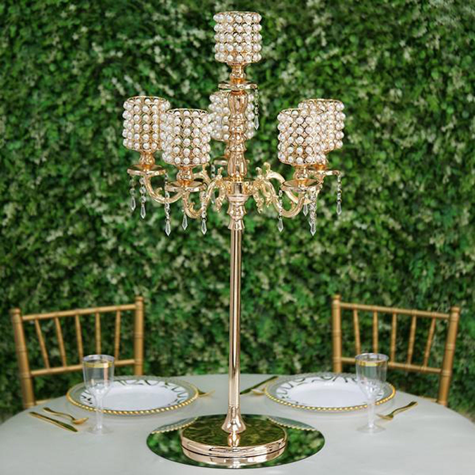 Gold pearl beaded candelabra centerpiece with crystal pendants.